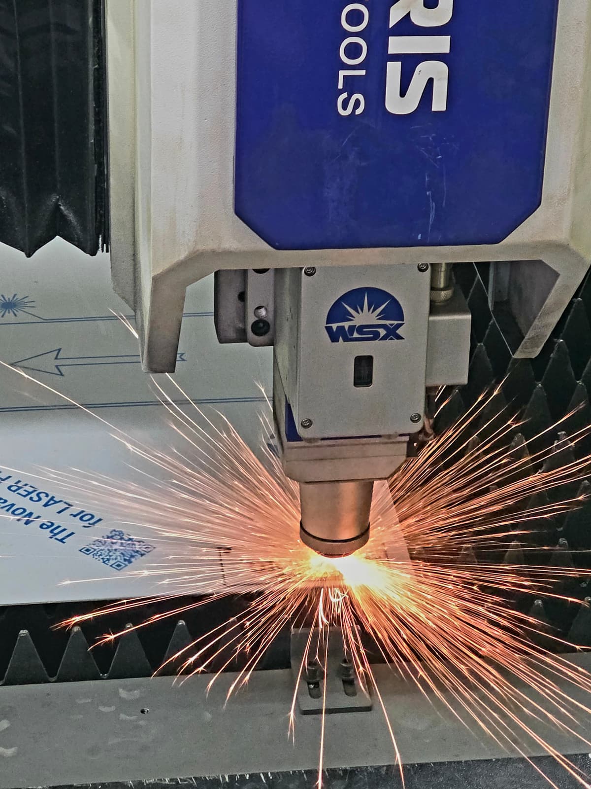 Laser cutting a metal sheet